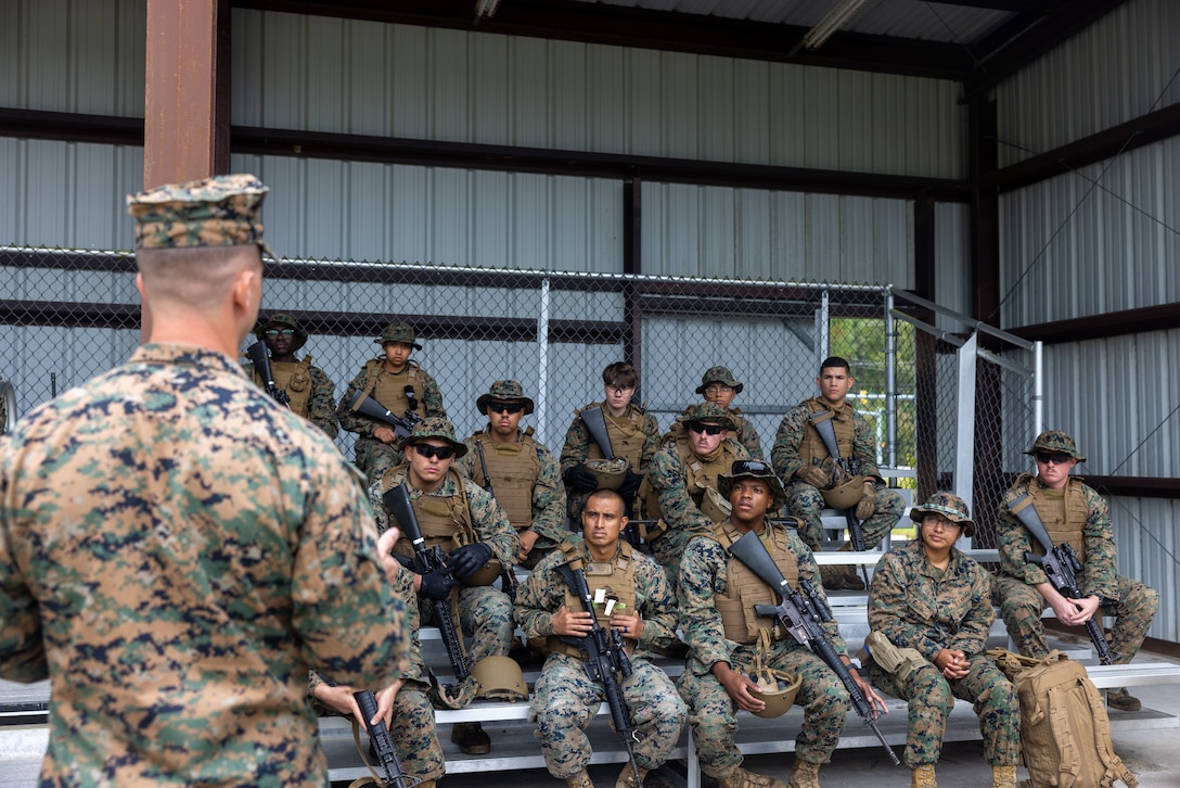 U.S. Marines and Sailors with Supply Company, 2nd Combat Readiness Regiment, 2nd Marine Logistics Group, receive a safety brief prior to executing a leadership reaction course as part of 2nd CRR’s field exercise at Marine Corps Base Camp Lejeune, Sept. 16, 2025. The REGFEX conducted by 2nd CRR is a large-scale training event designed to improve and sustain the regiment’s capability to deliver intermediate-level supply and maintenance support to II Marine Expeditionary Force, ensuring operational readiness in austere and expeditionary environments. (U.S. Marine Corps photo by Sgt. Rafael Brambila-Pelayo)
