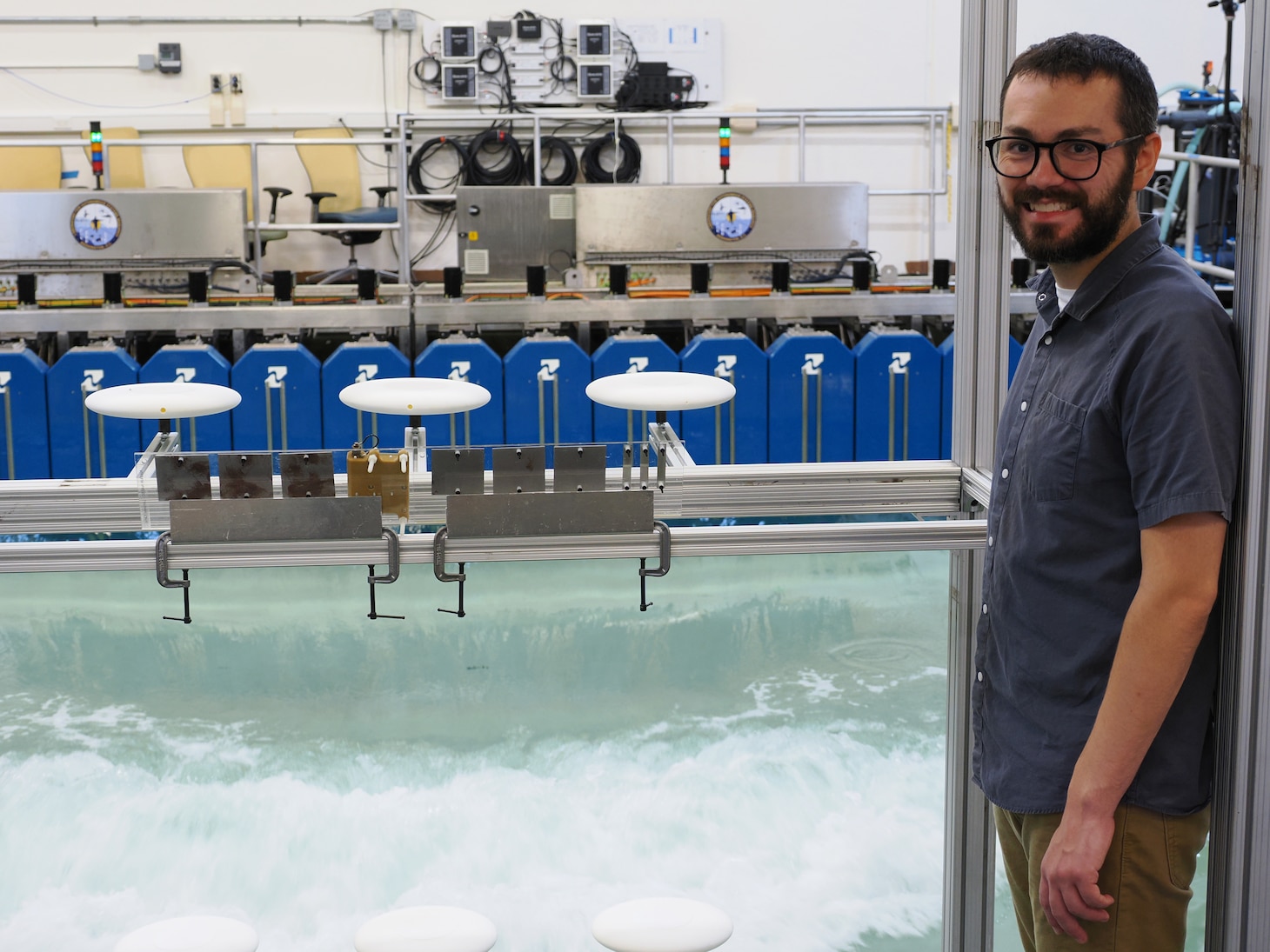 U.S. Naval Research Laboratory (NRL)-National Research Council (NRC) Postdoctoral Fellow with NRL’s Chemistry Division, Center for Corrosion Science and Engineering, Alex Johnson, next to symmetric airfoils used for measuring dry deposition of chloride and sulfate. This is used to study the impact of corrosion from saltwater aerosols at the NRL Laboratory for Autonomous Systems Research (LASR) Littoral Bay Wave Pool, in Washington, D.C., Sept. 24, 2024.