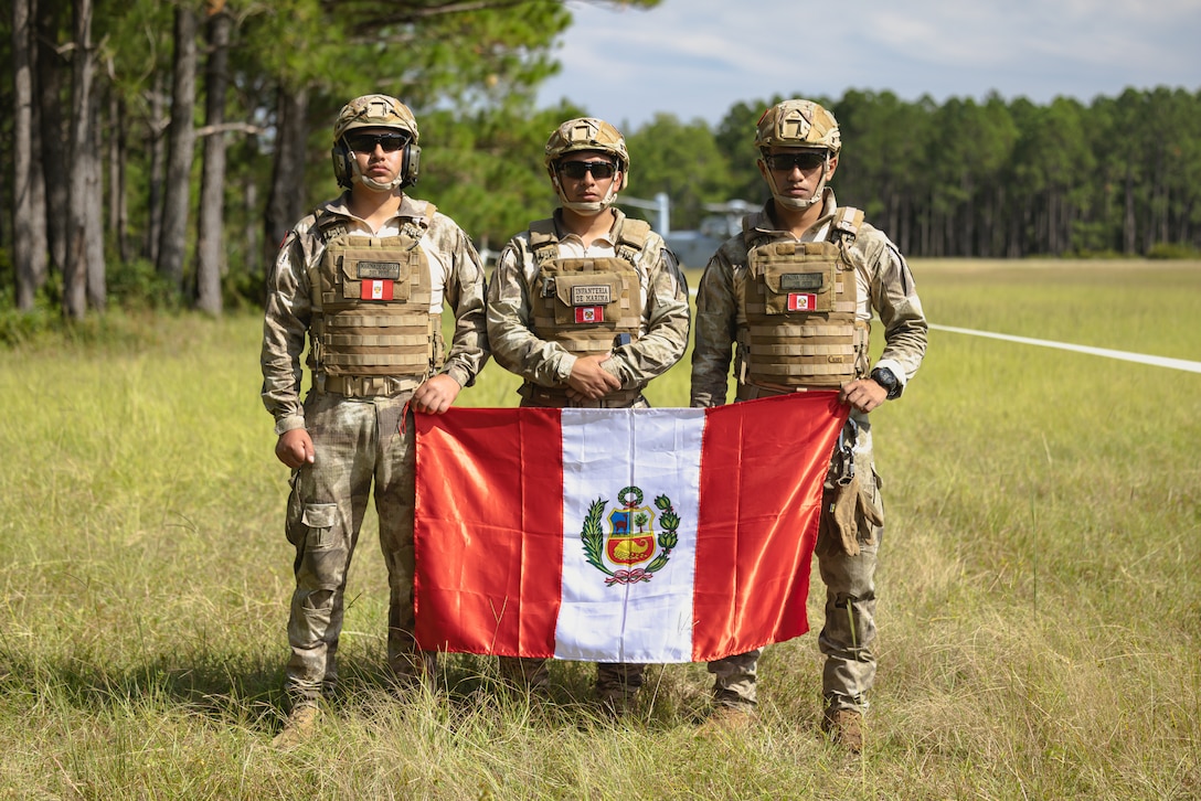 Marines with the Infanteria de Marina del Peru (Peruvian naval infantry) pose for a photo while attending helicopter support team operations alongside U.S. troops during exercise UNITAS 25 near Marine Corps Base Camp Lejeune, North Carolina, Sept. 18, 2025. UNITAS, which is Latin for “unity,” was conceived in 1959 and has taken place annually since first conducted in 1960. This year marks the 66th iteration of the world’s longest running annual multinational maritime exercise. The exercise trains forces in joint maritime operations that enhance tactical proficiency and increase interoperability with the presence of unmanned air, surface and submarine systems. (U.S. Marine Corps photo by Lance Cpl. Alyssa DeCrane)