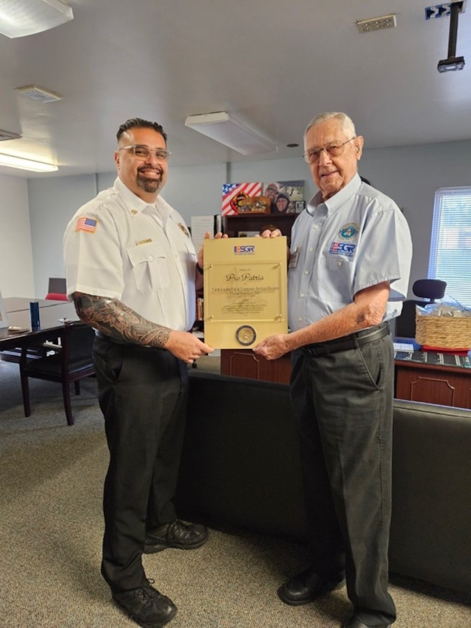 Members of Camp Lejeune Fire and Emergency Services Division pose with awards given by the Employer Support of the Guard and Reserve (ESGR). The ESGR Patriot and Pro Patria Awards recognize exceptional commitment to employees serving in the National Guard and military reserve components.
