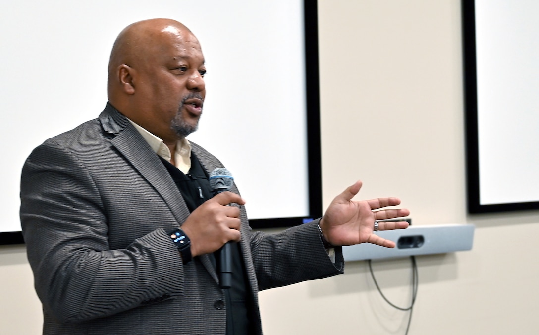 Cal Bailey leads a discussion with DCMA team members.