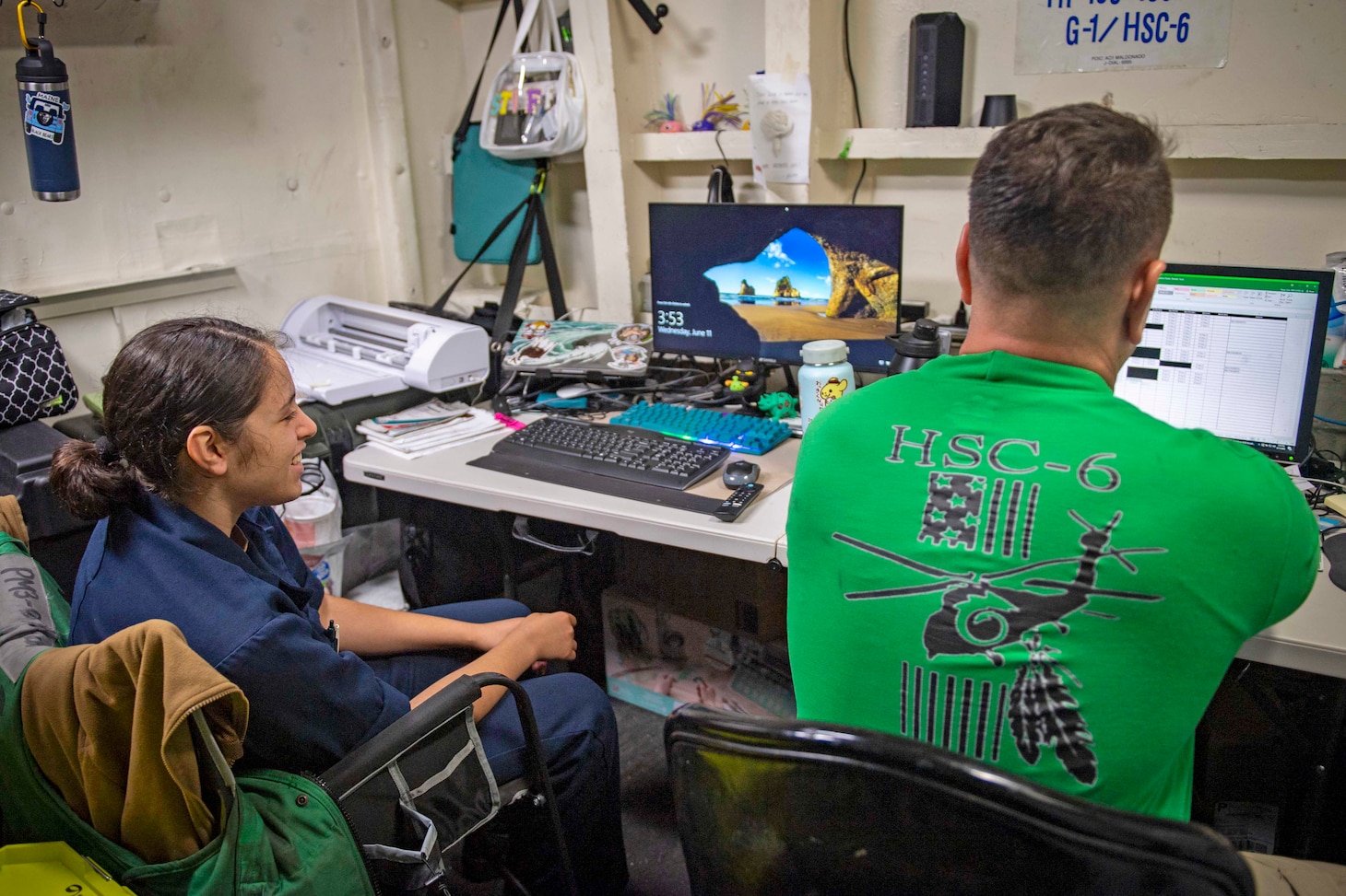 From left, U.S. Midshipmen 2nd Class Gabriella Reyes, from Miami, Florida observes her father, Senior Chief Aviation Machinist's Mate Dan Reyes during the work day aboard the aircraft carrier USS Nimitz (CVN 68) in the South China Sea, June 11, 2025. Nimitz is underway in the U.S. 7th Fleet area of operations on a scheduled deployment, demonstrating the U.S. Navy's unwavering commitment to a free and open Indo-Pacific