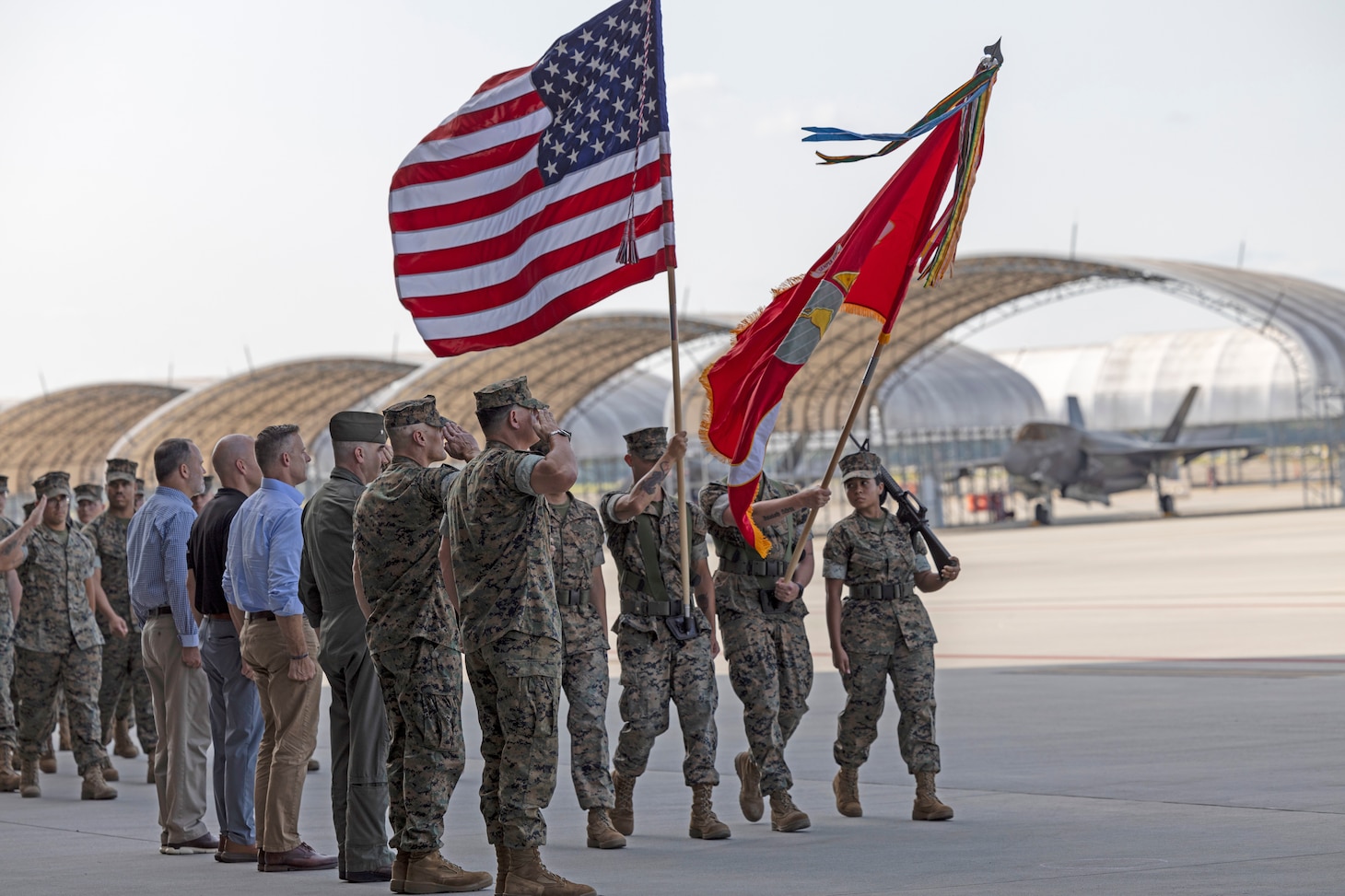 Current and former commanding officers of Marine All-Weather Fighter Attack Squadron (VMFA(AW)) 224 and Marine Fighter Attack Squadron (VMFA) 224 observe the pass and review during a squadron redesignation and change of command ceremony at Marine Corps Air Station Beaufort, South Carolina, June 26. The ceremony represented the squadron's transition from an all-weather F/A-18D Hornet squadron to an F-35B Lightning II squadron and signified the transfer of responsibility, authority, and accountability from Lt. Col. Jarrod Allen to Lt. Col. John P. Stuart.