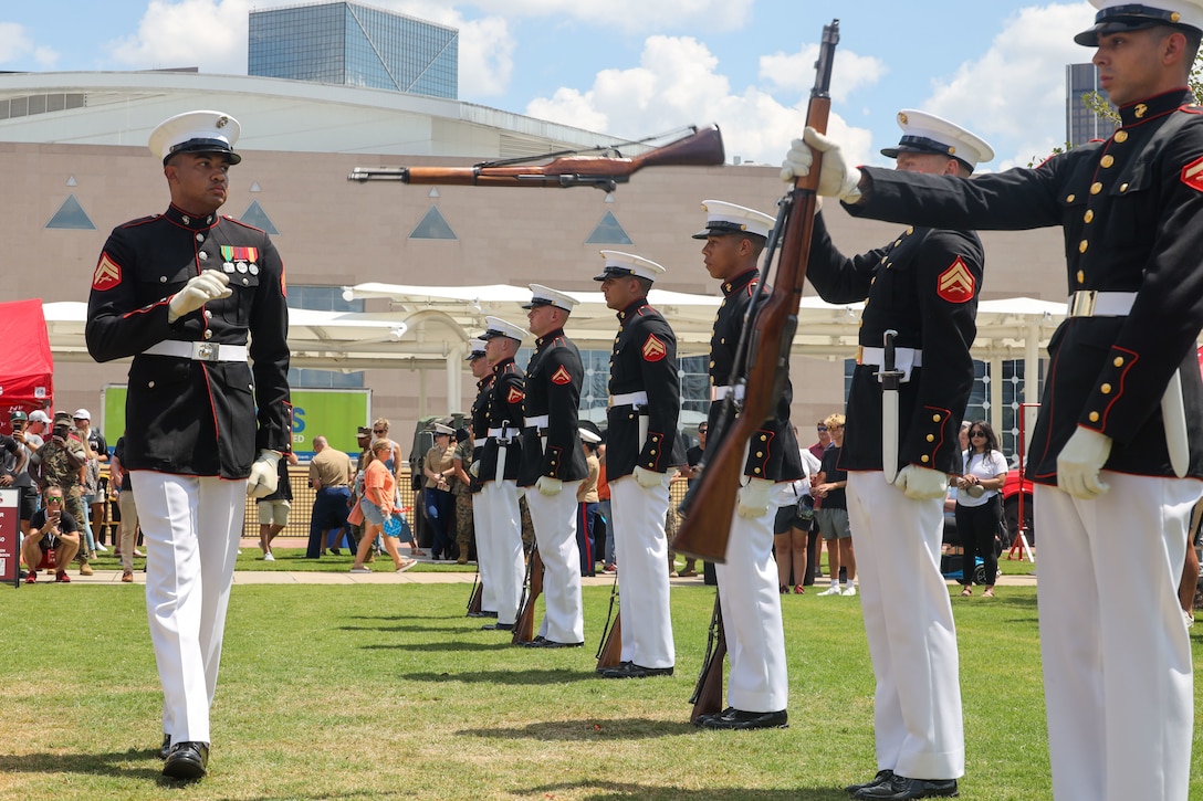 U.S. Marines with the United States Marine Corps Silent Drill Platoon execute their "double inspection" sequence during a performance at the College Football Aflac Kickoff show during Marine Week Atlanta in Atlanta, Ga., Aug. 31, 2025. The year 2025 marks the 250th anniversary of the United States Marine Corps, a milestone that highlights the legacy, transformation and enduring spirit of the Corps since 1775. Throughout the year, Marines across the globe will commemorate this anniversary by honoring the service and sacrifice of those who served before them and by remaining faithful to the motto Semper Fidelis. (U.S. Marine Corps photo by Cpl. Christopher Prelle)