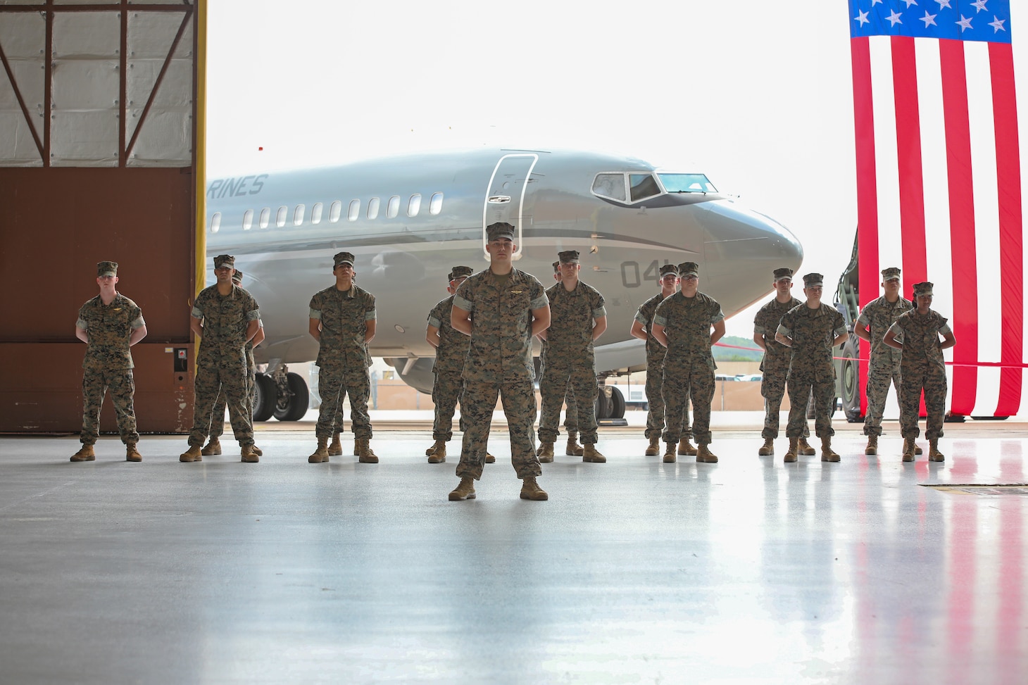 U.S. Marines with Marine Transport Squadron 1 (VMR-1), 4th Marine Aircraft Wing stand in formation during a Full Operational Capability ceremony at Naval Air Station Joint Reserve Base, Fort Worth, Texas on June 18. The Full Operational Capability ceremony is to celebrate VMR-1 becoming fully operational with 5 fully qualified C-40A crews and a full composite of ground and logistic support staff.