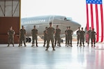 U.S. Marines with Marine Transport Squadron 1 (VMR-1), 4th Marine Aircraft Wing stand in formation during a Full Operational Capability ceremony at Naval Air Station Joint Reserve Base, Fort Worth, Texas on June 18. The Full Operational Capability ceremony is to celebrate VMR-1 becoming fully operational with 5 fully qualified C-40A crews and a full composite of ground and logistic support staff.
