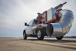 A truck affixed with a foreign object debris blower is staged on 
the airfield at Marine Corps Air Station Cherry Point, N.C., Feb. 25. FOD blowing uses equipment to clear debris from runways and airfields, ensuring the safety and efficiency of  aviation operations.