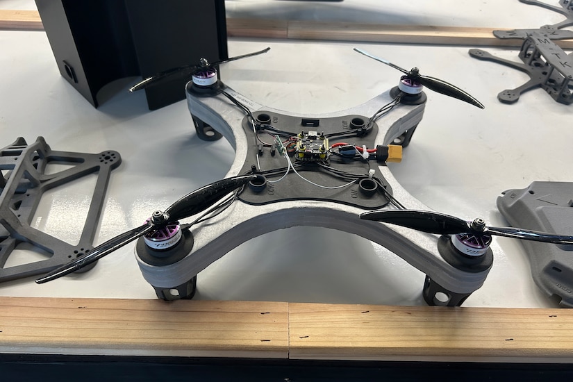 A small drone sits on a table.