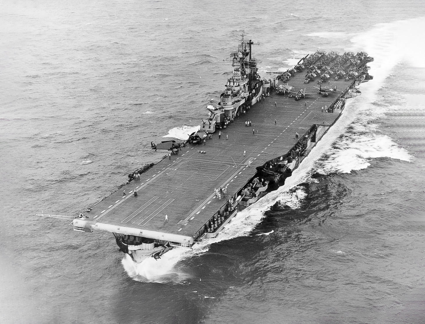 An air-to-sea view of USS Intrepid with Air Group 18 on the aft flight deck.