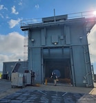 The Navy's restored T-10 Test Cell Facility at Naval Air Station Patuxent River will provide a controlled, weather-independent testing environment, reducing reliance on costly off-site evaluations and mitigating schedule risks, ensuring maintainers will have reliable, ready-for-use equipment to support engine repairs on the flight line.