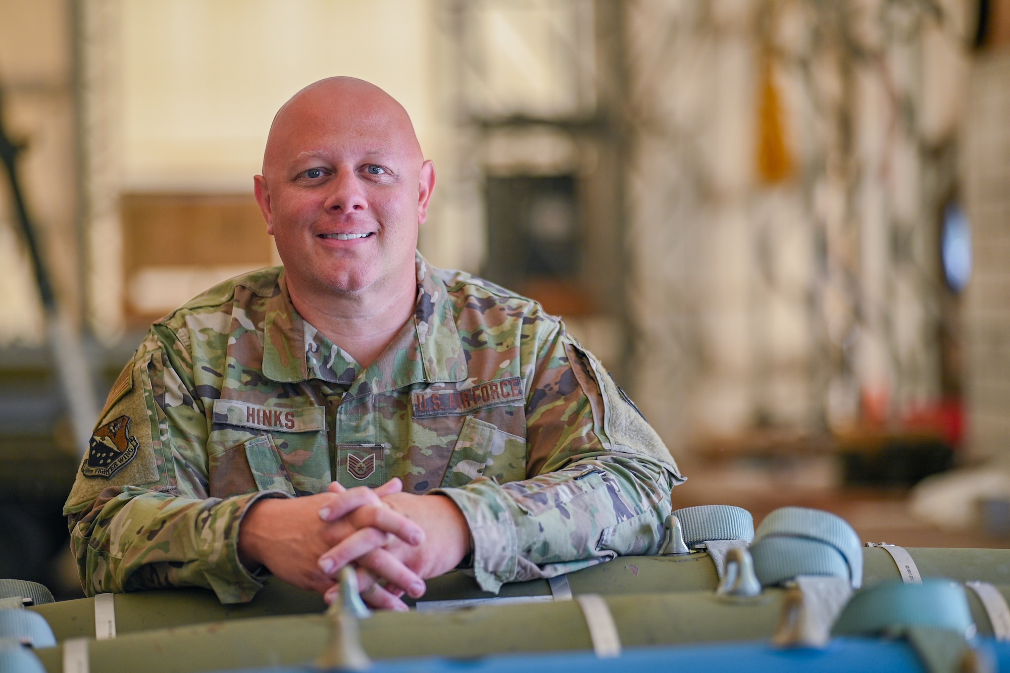 U.S. Air National Guard Tech. Sgt Hinks, 148th Fighter Wing munitions systems specialist, poses for a photo at the 148th Fighter Wing, Duluth, Minn., July 11,  2025. Hinks was the recipient of The American Red Cross’s National Awards Program Certificate of Extraordinary Personal Action. (U.S. Air National Guard Photo by Staff. Sgt. Tylin Rust)