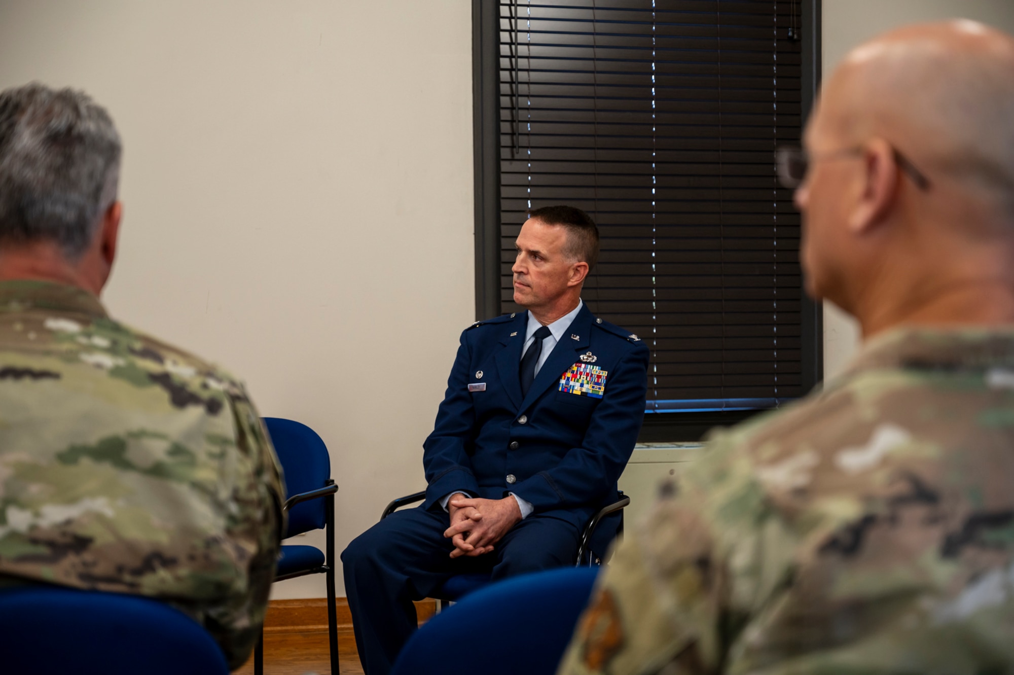 Col. Glen Hawley, commander of the 257th Combat Operations Flight, listens to the presiding officer's remarks during the 257th Combat Operations Flight redesignation ceremony.
