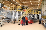 Artisans on the Fleet Readiness Center East (FRCE) H-53 aircraft line work on a CH-53K King Stallion, the first inducted for maintenance at the depot. FRCE inducted the aircraft April 17 as the first of 14 planned for induction as part of the Age Exploration Program, Depot (AEPD); it is the first King Stallion ever inducted for depot-level maintenance. AEPD collects information regarding the aircraft’s condition through controlled testing and analysis and assists in the development of effective and efficient maintenance schedule for new aircraft.