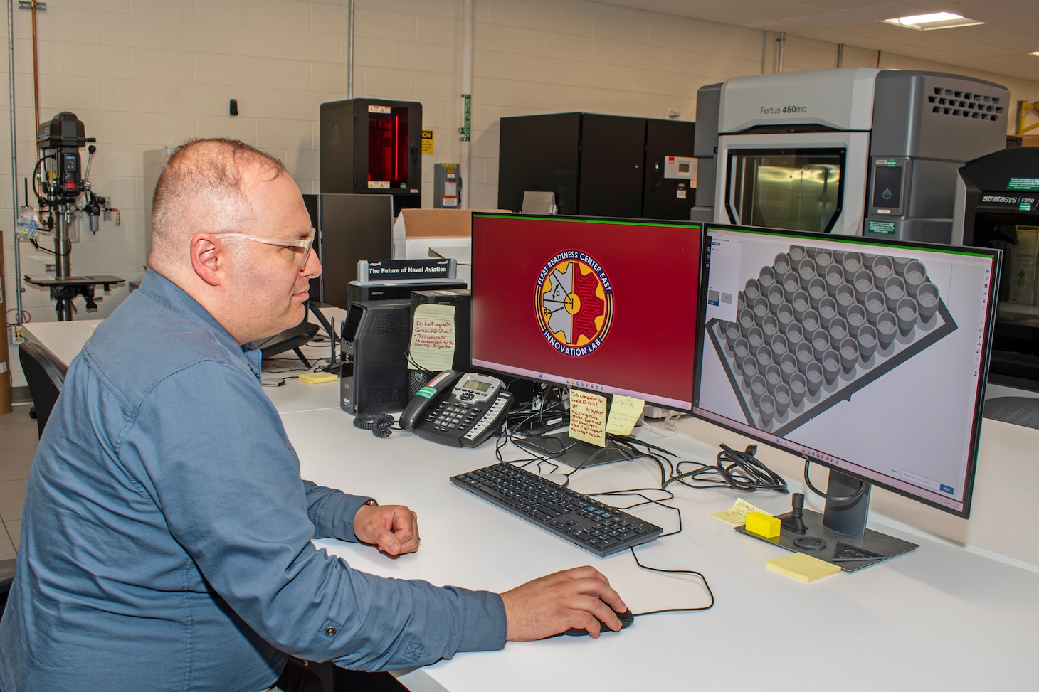 Fleet Readiness Center East Innovation Lab Lead Engineer Jeremy Bunting demonstrates the lab’s 3D printing build preparation software, which displays the model for an F-35 O-ring installation tool recently manufactured by the lab. The two-person team at the Innovation Lab used additive manufacturing – commonly referred to as 3D printing – to fulfill a critical request for 2,000 tools, and successfully completed the order under two weeks. Within days, the effort put tools in aircraft maintainers’ hands across the U.S. Marine Corps, Navy and Air Force. The turnaround time represented less than 10% of the estimated six months procurement would have taken through traditional acquisition methods.