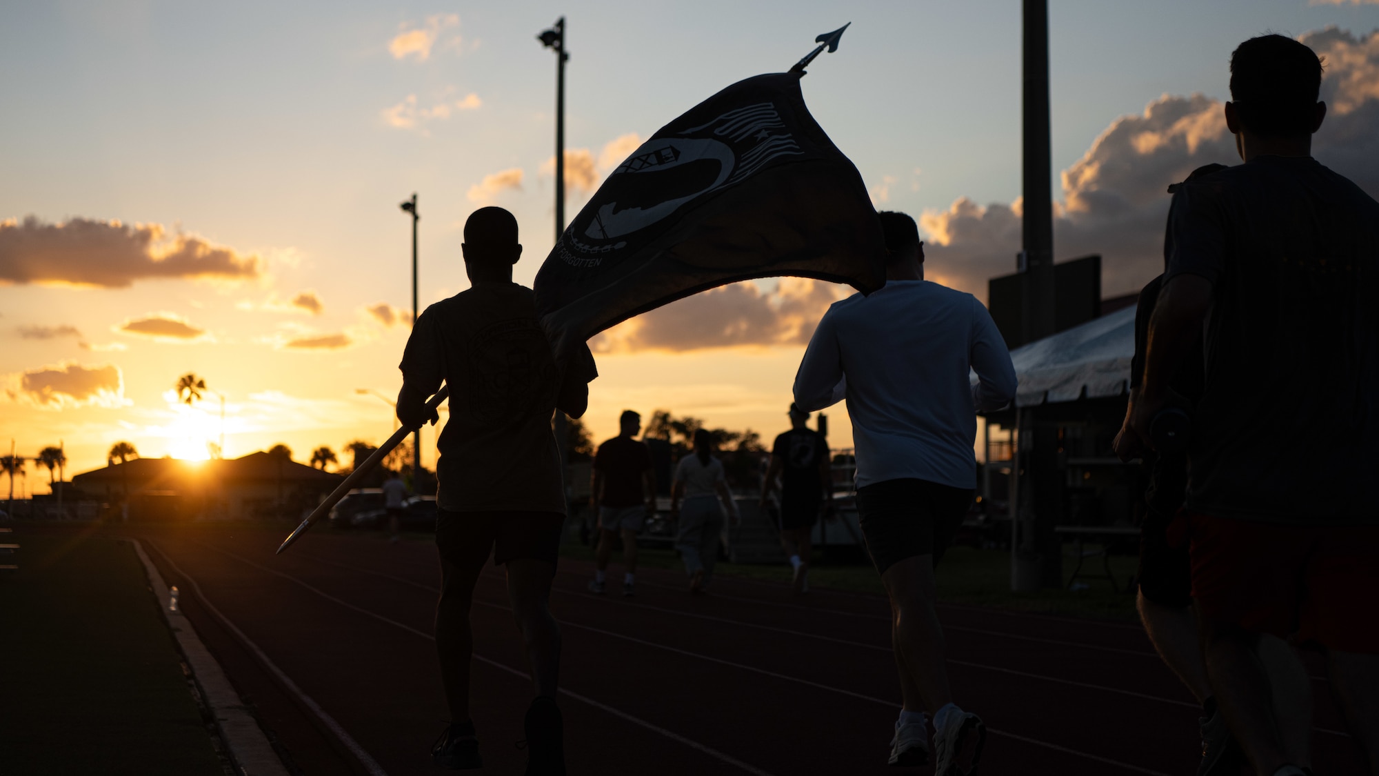 Airmen assigned to the 6th Communications Squadron, participate in a POW/MIA memorial run at MacDill Air Force Base, Florida, Sept. 18, 2025. Members from across the installation participated in recognition of the more than 81,000 Americans who remain missing from WWII, the Korean War, the Vietnam War, the Cold War, the Gulf Wars and other conflicts. (U.S. Air Force photo by Airman 1st Class Helen Ly)