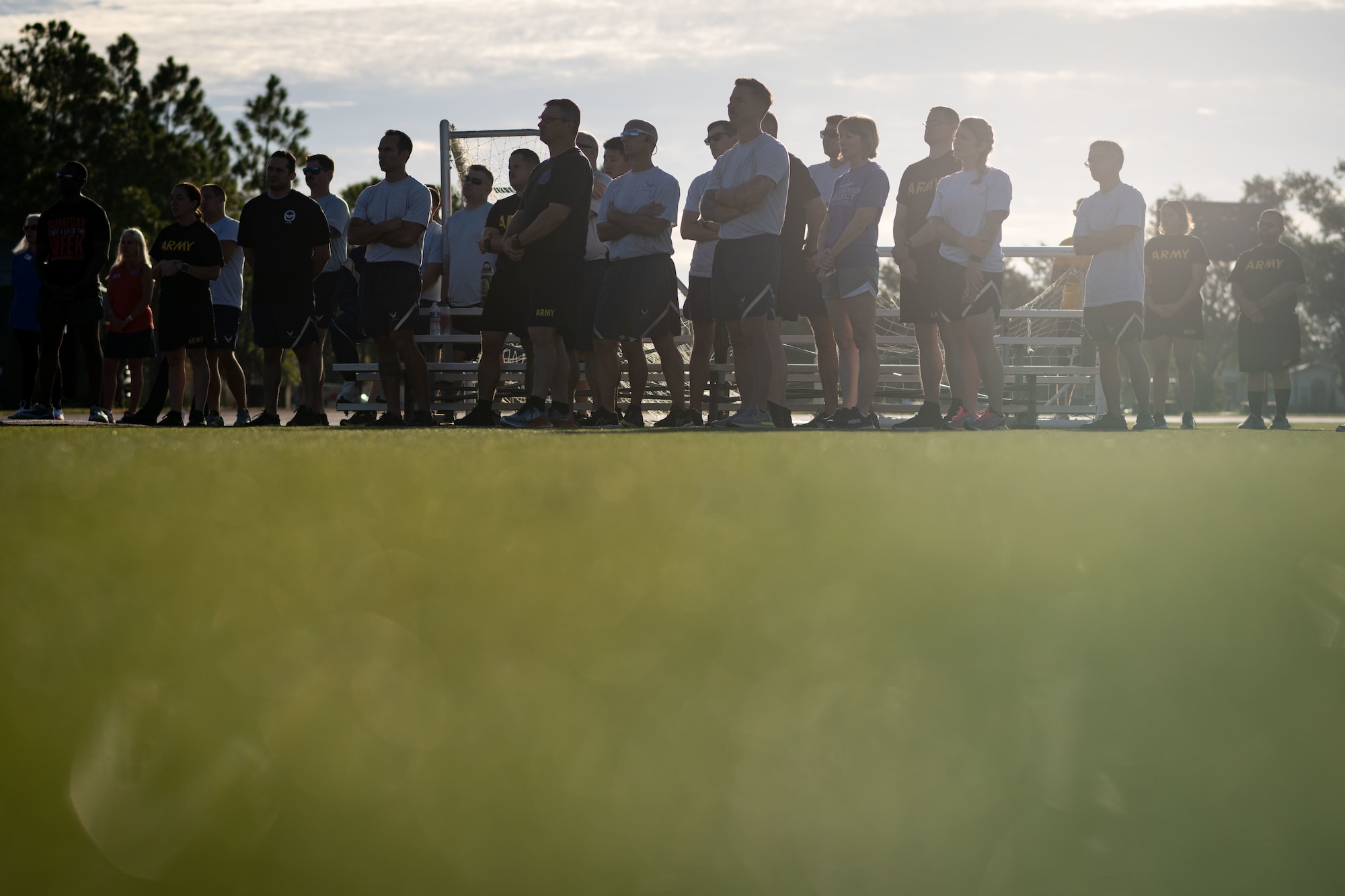 Joint force service members assigned to the 6th Air Refueling Wing and the Joint Communication Support Element listen as CDR Bradley E. Smith, U.S. Navy retired and former Vietnam POW, shares his story during the POW/MIA Recognition Day Opening Ceremony at MacDill Air Force Base, Florida, Sept. 18, 2025. Smith shared his experience as a U.S. Naval aviator and one of 591 Americans who were released from communist prisoner of war camps in Vietnam. (U.S. Air Force photo by Senior Airman Zacahry Foster)