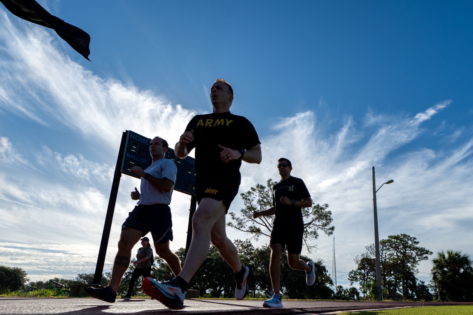 Joint force service members assigned to the 6th Air Refueling Wing and Joint Communication Support Element participate in the POW/MIA Recognition Day memorial run at MacDill Air Force Base, Florida Sept. 18, 2025. Members from across the installation assembled in recognition of the more than 81,000 Americans who remain missing from WWII, the Korean War, the Vietnam War, the Cold War, the Gulf Wars and other conflicts. (U.S. Air Force photo by Senior Airman Zachary Foster)