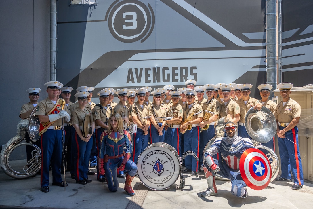 U.S. Marines with the 1st Marine Division Band pose for a group photo with character actors after the band’s stationary performance at Disneyland California Adventure Park in Anaheim, California, July 4, 2025. The 1st MARDIV Band was featured in several parades and stationary performances during the park’s annual Independence Day celebration. (U.S. Marine Corps photo by Sgt. Calah Thompson)