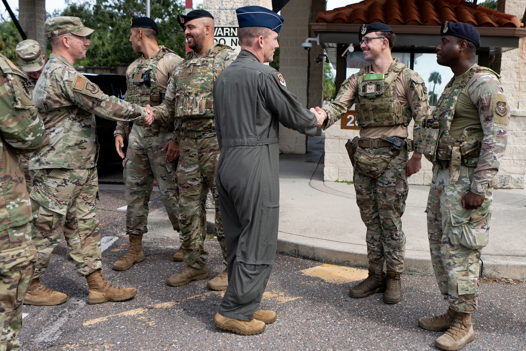 U.S. Air Force Maj. Gen. Darren Cole, 21st Air Force and U.S. Air Force Expeditionary Center commander, and Chief Master Sgt. Dennis Fuselier, 21st Air Force and U.S. Air Force Expeditionary Center command chief, greet 6th Security Forces Squadron defenders at MacDill Air Force Base, Florida Sept. 17, 2025. The 21st AF and USAF EC command team gained firsthand insight into their development, challenges and initiatives to ensure Total Force Warrior-Airmen are trained, armed and equipped to operate across the warfighting spectrum. (U.S. Air Force photo by Airman 1st Class Helen Ly)