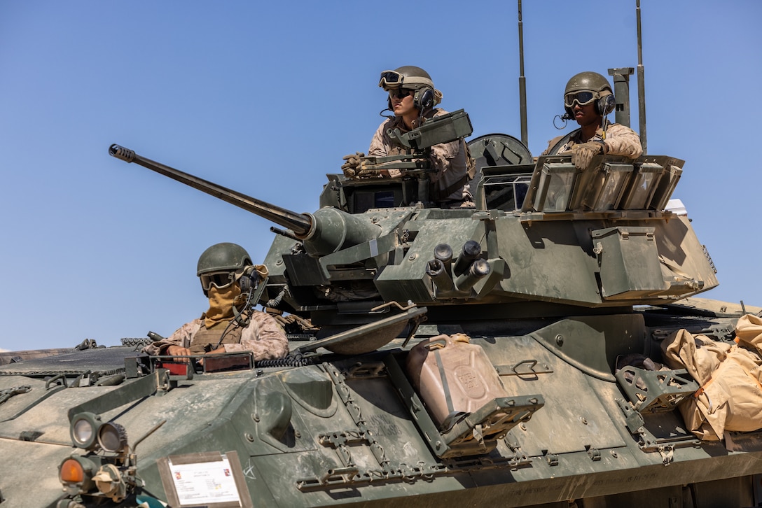U.S. Marines assigned to 4th Light Armored Reconnaissance, prepare for maneuvers in a light armored vehicle (LAV) during a joint training exercise as part of BRIGHT STAR 25 at Mohamed Naguib Military Base (MNMB), Egypt, Sep. 3, 2025. BRIGHT STAR 25 fosters readiness, improves mil-to-mil coordination, provides opportunities to share best practices, and strengthens bonds between our forces. (U.S. Army Photo by Joseph Kumzak)