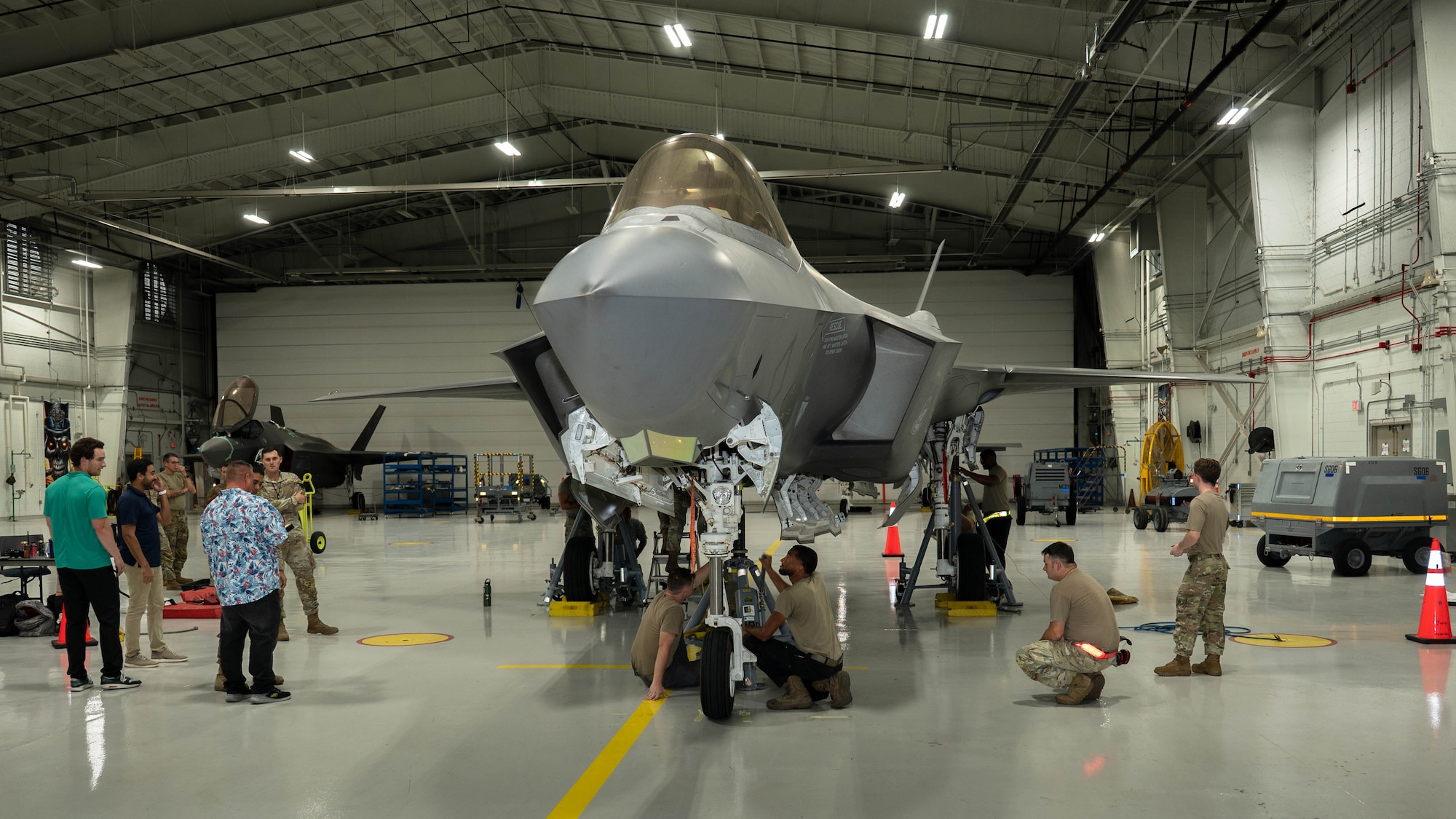 U.S Airmen and Lockheed Martin personnel conduct load testing on an F-35A Lightning II