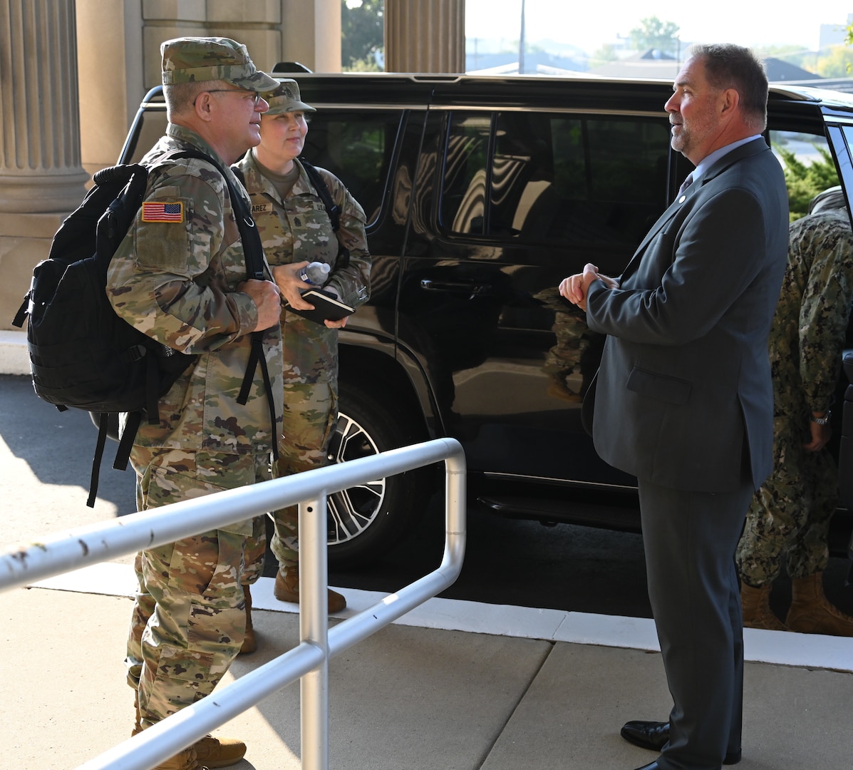 DLA Disposition Services Director Mike Cannon (right) greets Army Lt. Gen. Mark Simerly (left), director, Defense Logistics Agency, and Command Sgt. Maj. Petra Casarez (center), Senior Enlisted Leader, Defense Logistics Agency, at the Hart-Doyle-Inouye Federal Center Sept. 19.