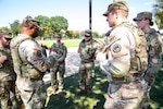 U.S. Army Lt. Col. Steven Jackson, commander of the 112th Military Police Battalion, Mississippi National Guard, speaks with Soldiers of the 239th Military Police Company, Louisiana National Guard, while on patrol of the National Mall in Washington, D.C., Aug. 23, 2025. About 2,000 National Guard members are supporting the D.C. Safe and Beautiful mission, providing critical assistance to the Metropolitan Police Department to help ensure the safety of residents and visitors.