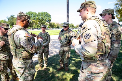 U.S. Army Lt. Col. Steven Jackson, commander of the 112th Military Police Battalion, Mississippi National Guard, speaks with Soldiers of the 239th Military Police Company, Louisiana National Guard, while on patrol of the National Mall in Washington, D.C., Aug. 23, 2025.