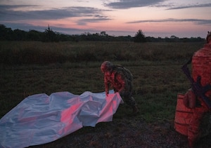 Airmen from Altus Air Force Base’s 97th Civil Engineer Squadron, Readiness and Emergency Management Flight set up a decontamination line at Fort Sill, Oklahoma, September 7, 2025. The Airmen traveled to Fort Sill to support the U.S. Army’s 3-2 Air Defense Artillery Battalion in achieving its Chemical, Biological, Radiological, and Nuclear training objectives. (U.S. Air Force photo by Tech. Sgt. Hailey Haux)
