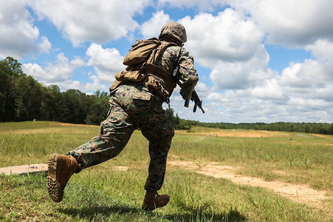 U.S. Marine Corps Lance Cpl. Evan Johnson, a rifleman with Bravo Company, Marine Barracks Washington, conducts a fire and movement drill at Marine Corps Base Quantico, Va., Aug. 12, 2025. The exercise sharpened the unit’s marksmanship, communication and coordinated maneuver skills. (U.S. Marine Corps photo by Lance Cpl. Brynn L. Bouchard)