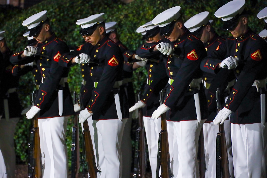 U.S. Marines with Bravo Company, Marine Barracks Washington, fix bayonets during the final Evening Parade of the 2025 season at Marine Barracks Washington, D.C., Aug. 22, 2025. Lt. Gen. Benjamin Watson, commanding general of Training and Education Command, served as the hosting official, and His Excellency Lord Peter Mandelson, British ambassador to the United States, was the guest of honor. Evening Parades, held every Friday during the summer, feature the U.S. Marine Corps Silent Drill Platoon, “The President’s Own” U.S. Marine Band, “The Commandant’s Own” U.S. Marine Drum and Bugle Corps, and the official Marine Corps Color Guard, showcasing the precision, discipline and 250 years of tradition that define the Corps. (U.S. Marine Corps photo by Cpl. Christopher Prelle)
