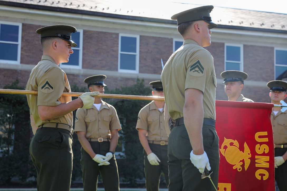 U.S. Marines with Bravo Company, Marine Barracks Washington, are evaluated on their guidon sequences at Marine Barracks Washington, D.C., Sep. 4, 2025. Marines in both Alpha and Bravo Company participate in guidon training as a part of ceremonial drill school . After completion of CDS, these Marines will execute events such as funerals at Arlington National Cemetary and around the National Capitol Region. (U.S. Marine Corps photo by Cpl. Christopher Prelle)