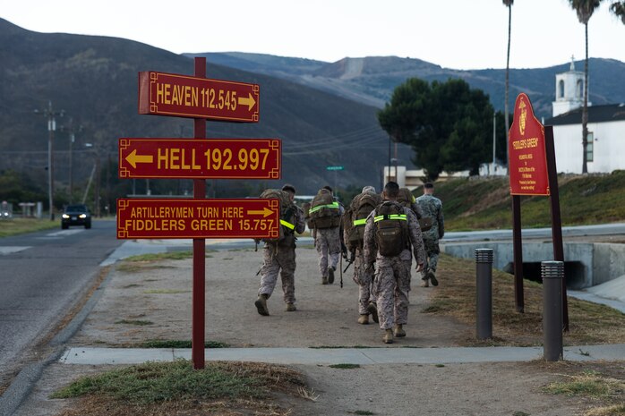 U.S. Marines with Fire Support Battalion, 11th Marine Regiment, 1st Marine Division, hike to their next station during the company fire support team competition at Marine Corps Base Camp Pendleton, California, Sept. 19, 2025. The company FST competition tests teams’ technical and tactical skills under stress, building proficiency, teamwork, and readiness to integrate fires effectively in combat. (U.S. Marine Corps photo by Sgt. Atticus Martinez)