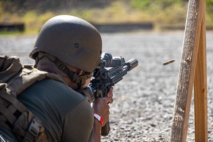 Nayos Thammaraks, a volunteer with Friends of the 1st CEB, fires an M27 infantry automatic rifle during Warrior Family Day at Marine Corps Base Camp Pendleton, California, Sept. 18, 2025. Warrior Family Day, hosted by 1st Combat Engineer Battalion, 1st Marine Division, gave friends and family members of Marines the opportunity to experience a day in the Corps. (U. S. Marine Corps photo by Lance Cpl. Stella Tedesco)
