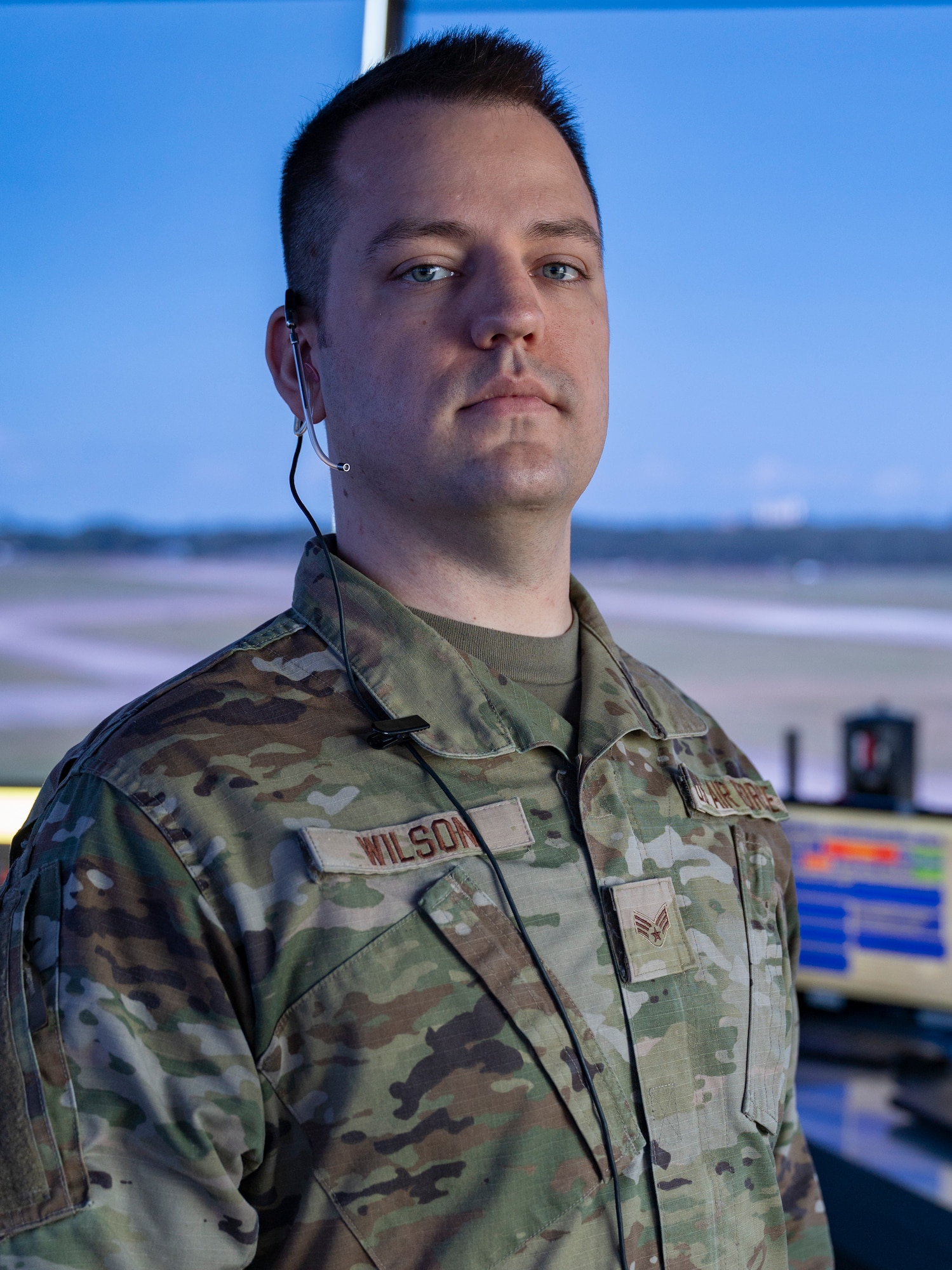 A man in military uniform poses for a photo.