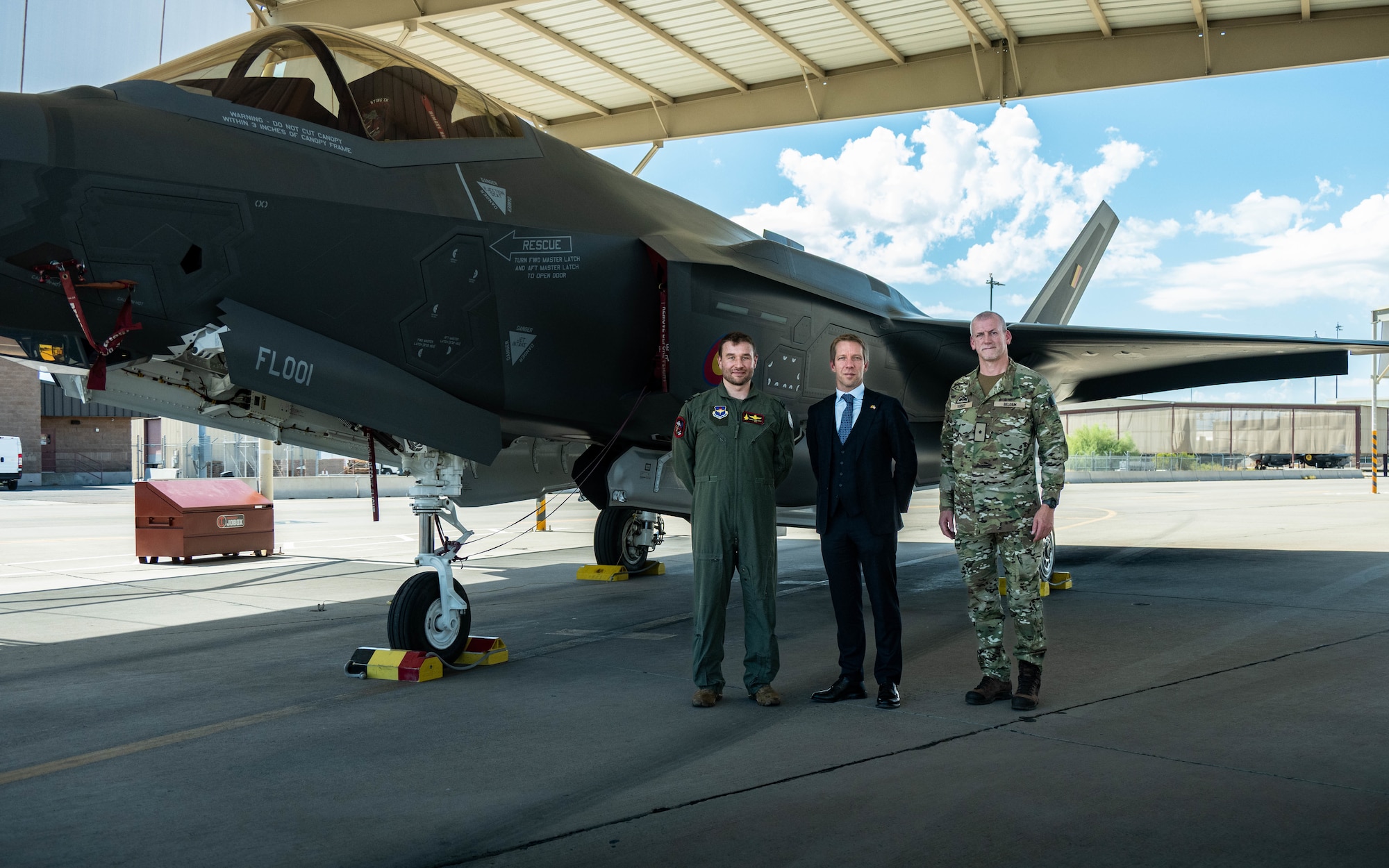 Belgian Air Force Lt. Col. Pierre-Yves Libert (left), 312th Fighter Squadron senior national representative, Frederic Bernard (middle), Belgian Ambassador to the United States, and Belgian Brig. Gen. Bart Verbist (right), Belgian Defense Attaché, poses in front of an F-35A Lightning II