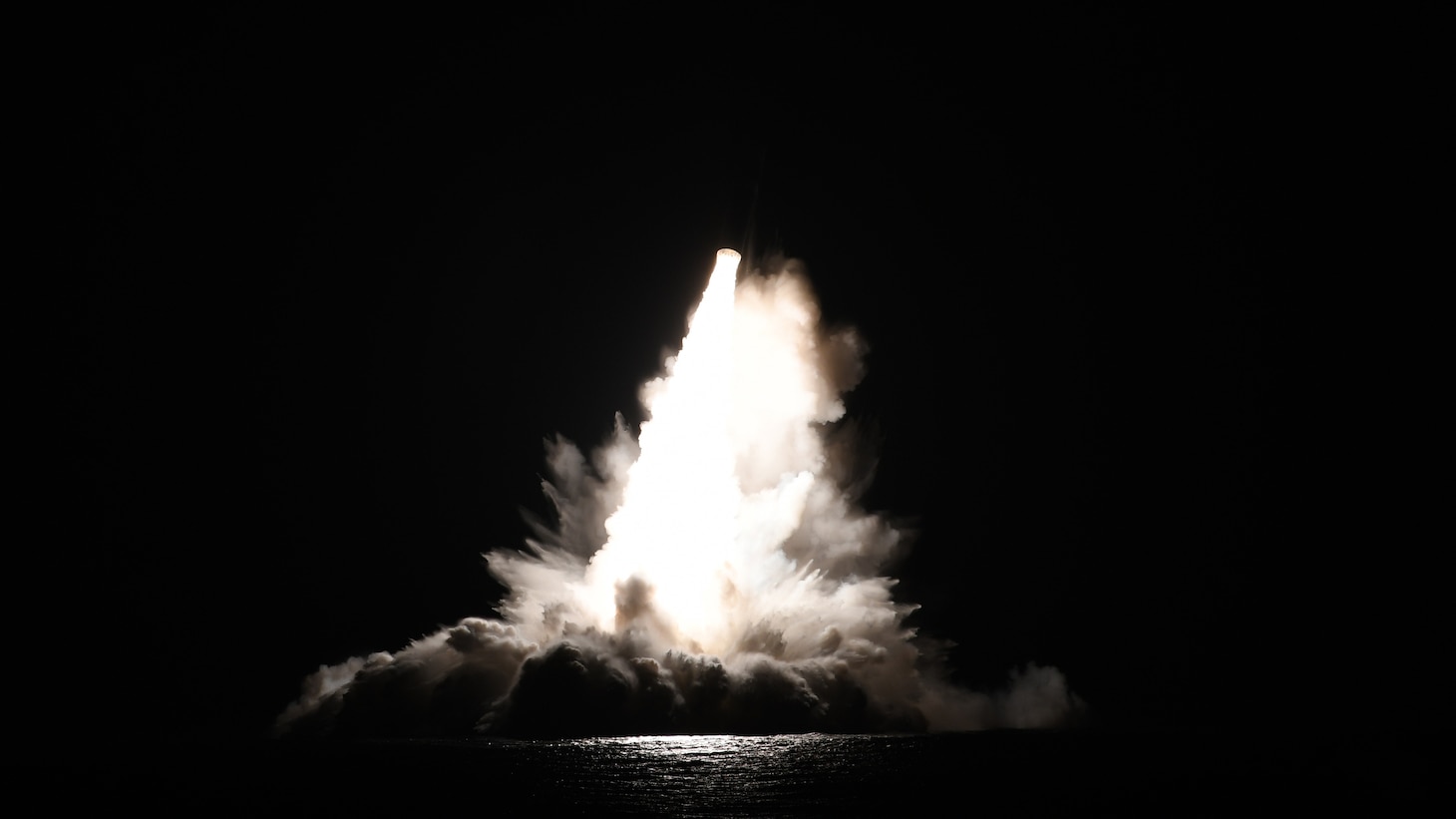 An unarmed Trident II D5 Life Extension (D5LE) missile launches from an Ohio-class ballistic missile submarine (SSBN) off the coast of Florida. One launch test event Sunday evening lit up the night sky and was visible from Puerto Rico.