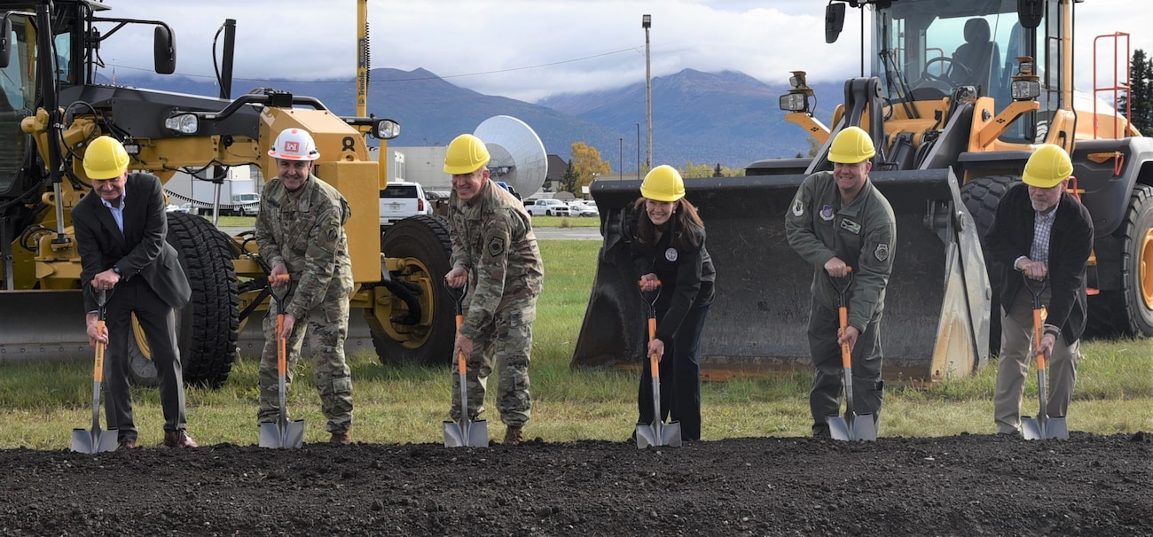 Col. Jeffrey Palazzini, district commander, joined Lt. Gen. Case Cunningham, commander of Alaska NORAD Region, Alaskan Command and Eleventh Air Force, and other distinguished guests to celebrate the groundbreaking for the Joint Integrated Test and Training Center at Joint Base Elmendorf-Richardson on Sep. 22.
The center will be the first of its kind, enabling important joint and multinational force training. The $332 million project will construct a state-of-the-art, 150,000-square-foot, two-story building designed to withstand cold weather conditions. Areas include 11 simulator rooms, briefing rooms, mission operation centers, central server room, storage and more. The JITTC-E is designed to aid face-to-face mission planning, briefing, execution, supervision and debriefing at the highest tactical and operational levels of the Air Force.