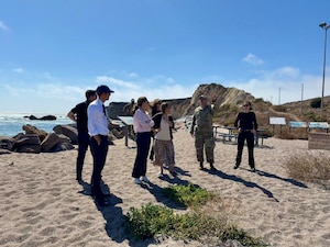 U.S. Space Force Lt. Col. Kyle Rowland, Chief of Spaceport Integration, speaks to members of the Governor's Office of Business and Economic Development (GoBiz) and Regional Economic Action Coalition (REACH) about infrastructure improvements at the Vandenberg harbor at Vandenberg Space Force base, Calif., Sept. 12, 2025. GoBiz recently awarded a $9.5 million grant to the "Space Vandenberg" initiative, aimed at boosting space industry infrastructure in California and expanding workforce development.
