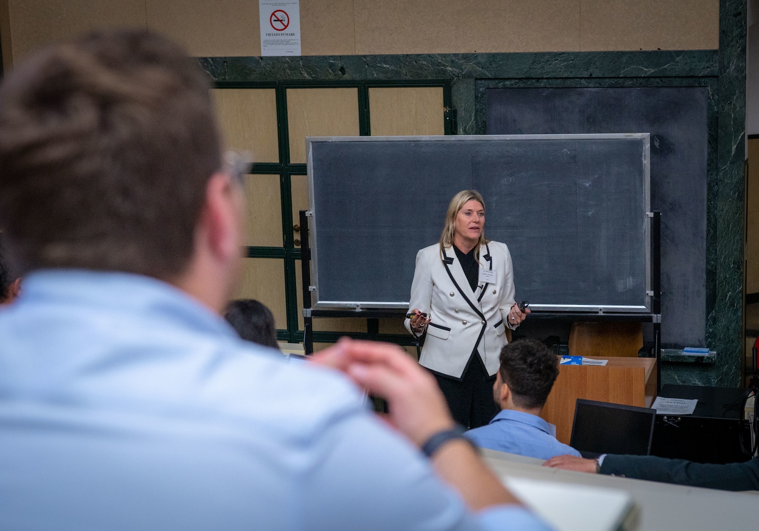 Dr. Debra Prince Zinni, Defense POW/MIA Accounting Agency laboratory director and supervisory forensic anthropologist, briefs about the collaboration and complexities that are involved in transporting human remains across international borders during the fourth Scientific Summit in Milan, Italy, Sept. 17, 2025.
