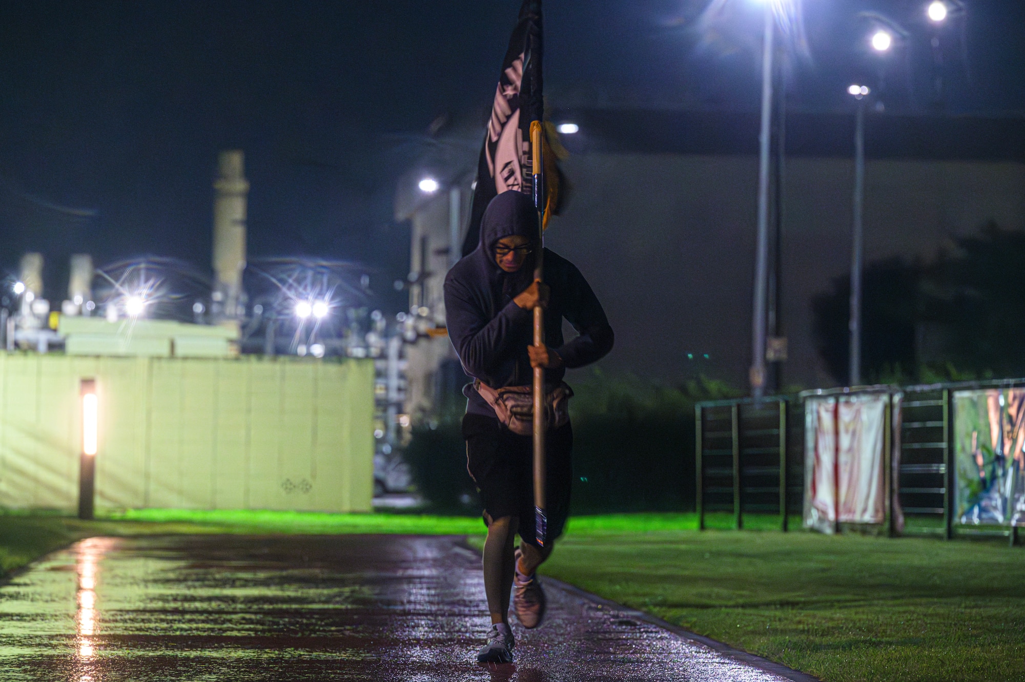 participants carry the POW/MIA flag during the POW/MIA Memorial Relay