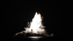 An unarmed Trident II D5 Life Extension (D5LE) missile launches from an Ohio-class ballistic missile submarine (SSBN) off the coast of Florida. One launch test event Sunday evening lit up the night sky and was visible from Puerto Rico.