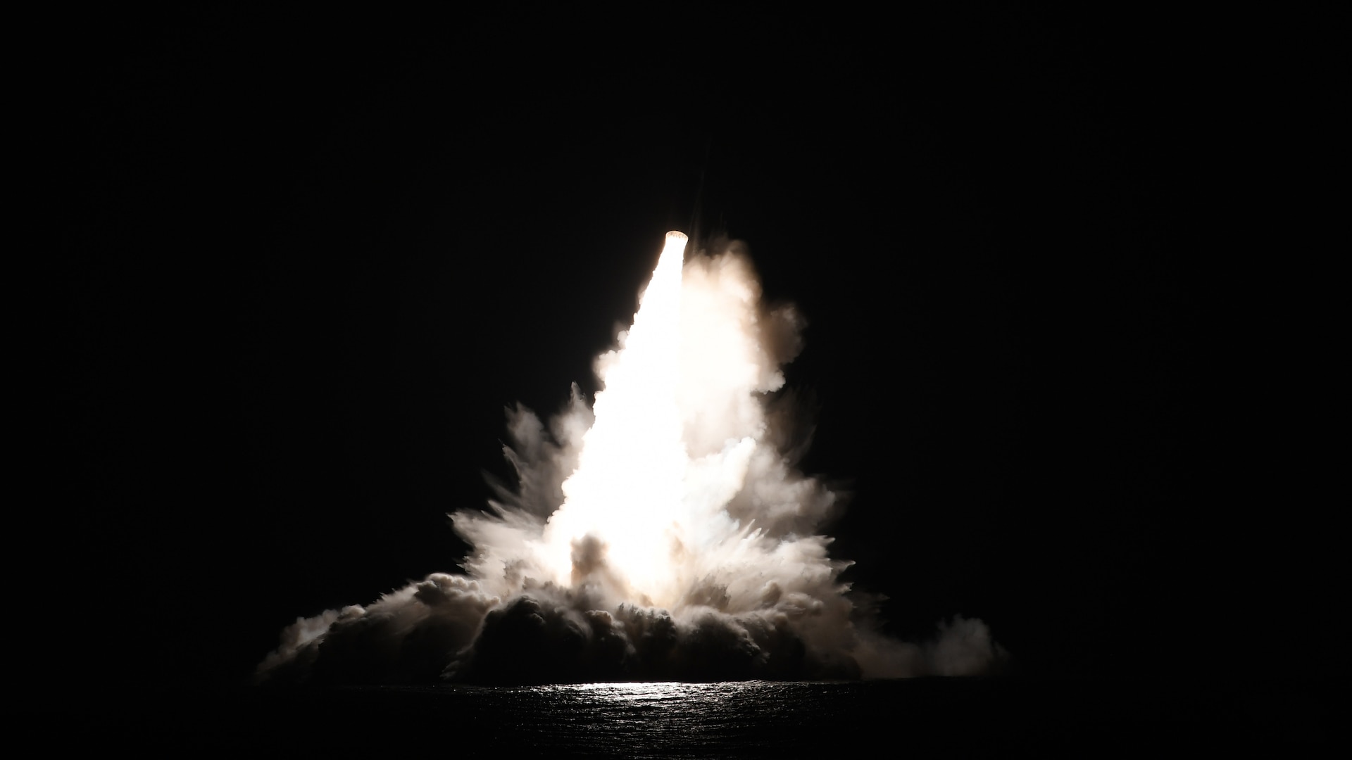 An unarmed Trident II D5 Life Extension (D5LE) missile launches from an Ohio-class ballistic missile submarine (SSBN) off the coast of Florida. One launch test event Sunday evening lit up the night sky and was visible from Puerto Rico.