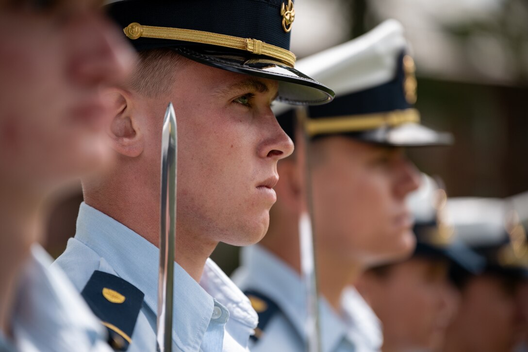Coast Guard Academy stand in formation during a change of watch ceremony at the Coast Guard Academy, August 20, 2024. The ceremony marks the transition of the summer leadership team to the fall semester command. (U.S. Coast Guard photograph by Petty Officer 3rd Class Matt Thieme)