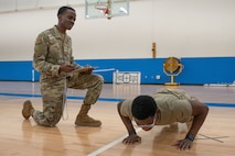 Airmen perform a PT test.