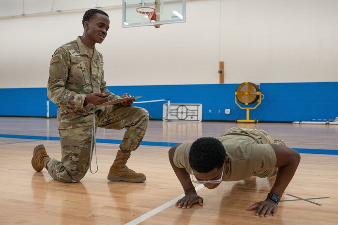 Airmen perform a PT test.