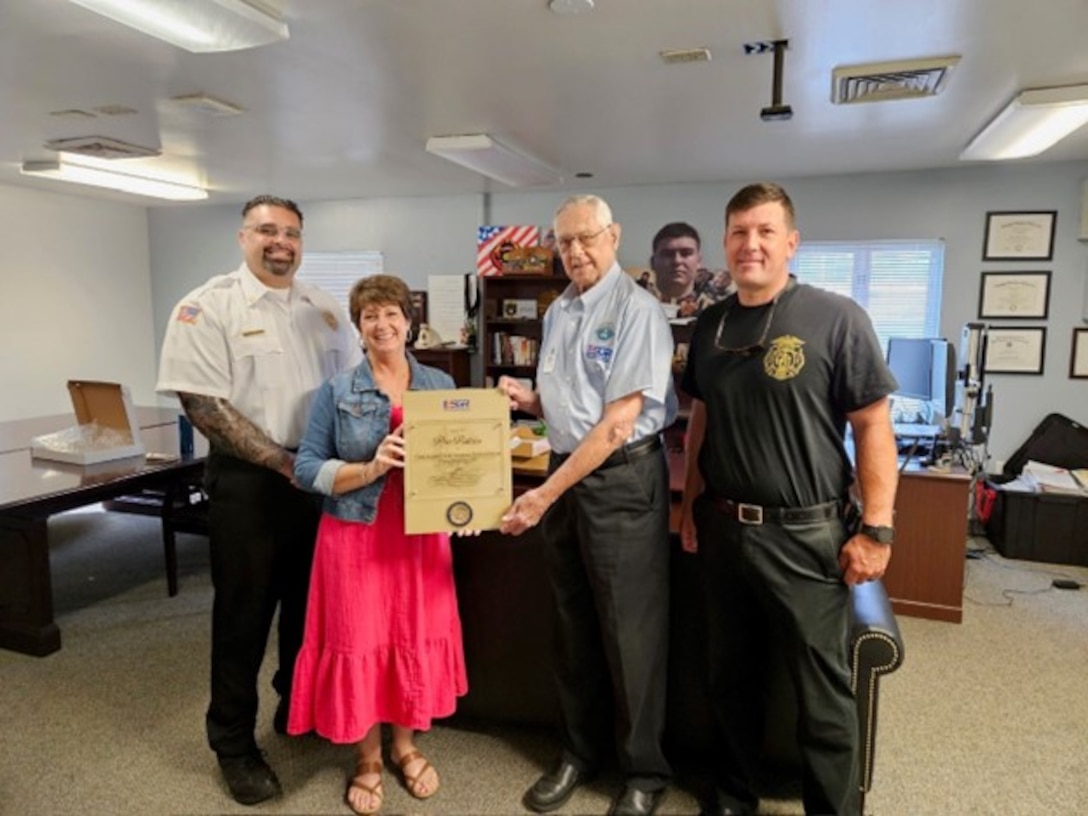 Members of Camp Lejeune Fire and Emergency Services Division pose with awards given by the Employer Support of the Guard and Reserve (ESGR). The ESGR Patriot and Pro Patria Awards recognize exceptional commitment to employees serving in the National Guard and military reserve components.