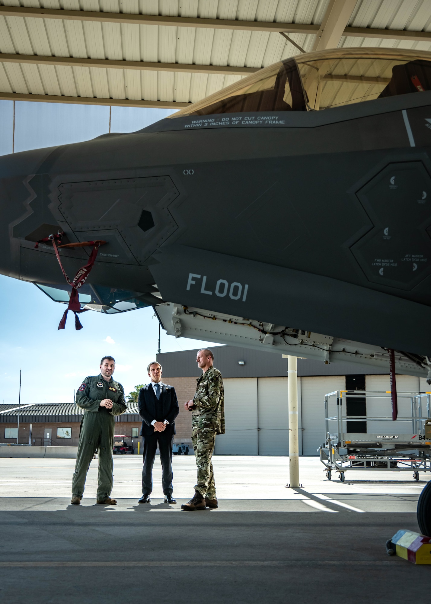 Belgian Air Force Lt. Col. Pierre-Yves Libert (left), 312th Fighter Squadron senior national representative, Frederic Bernard (middle), Belgian Ambassador to the United States, and Belgian Brig. Gen. Bart Verbist (right), Belgian Defense Attaché, view an F-35A Lightning II