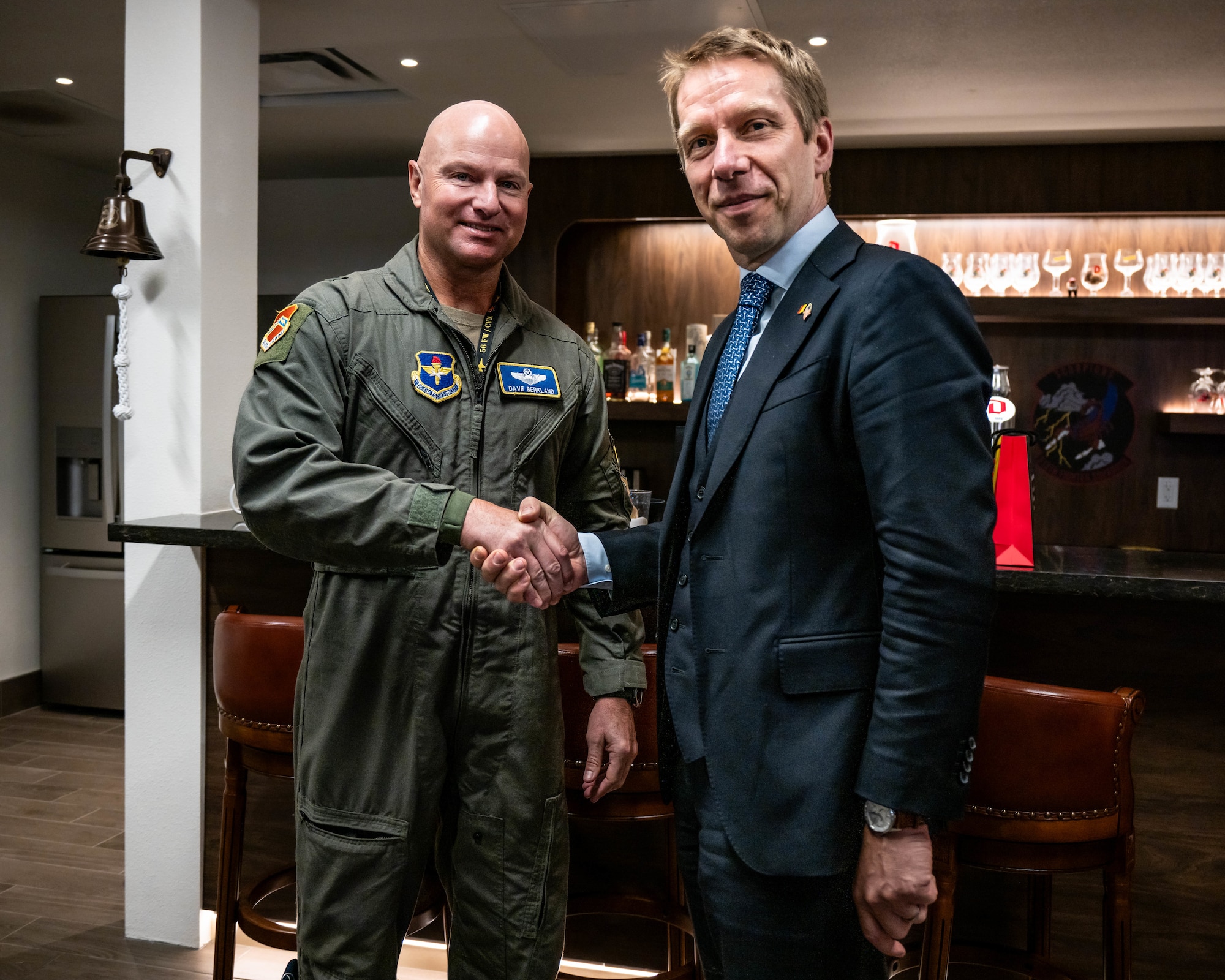U.S. Air Force Brig. Gen. David Berkland (left), 56th Fighter Wing commander, and Frederic Bernard (right), Belgian Ambassador to the United States, pose for a photo