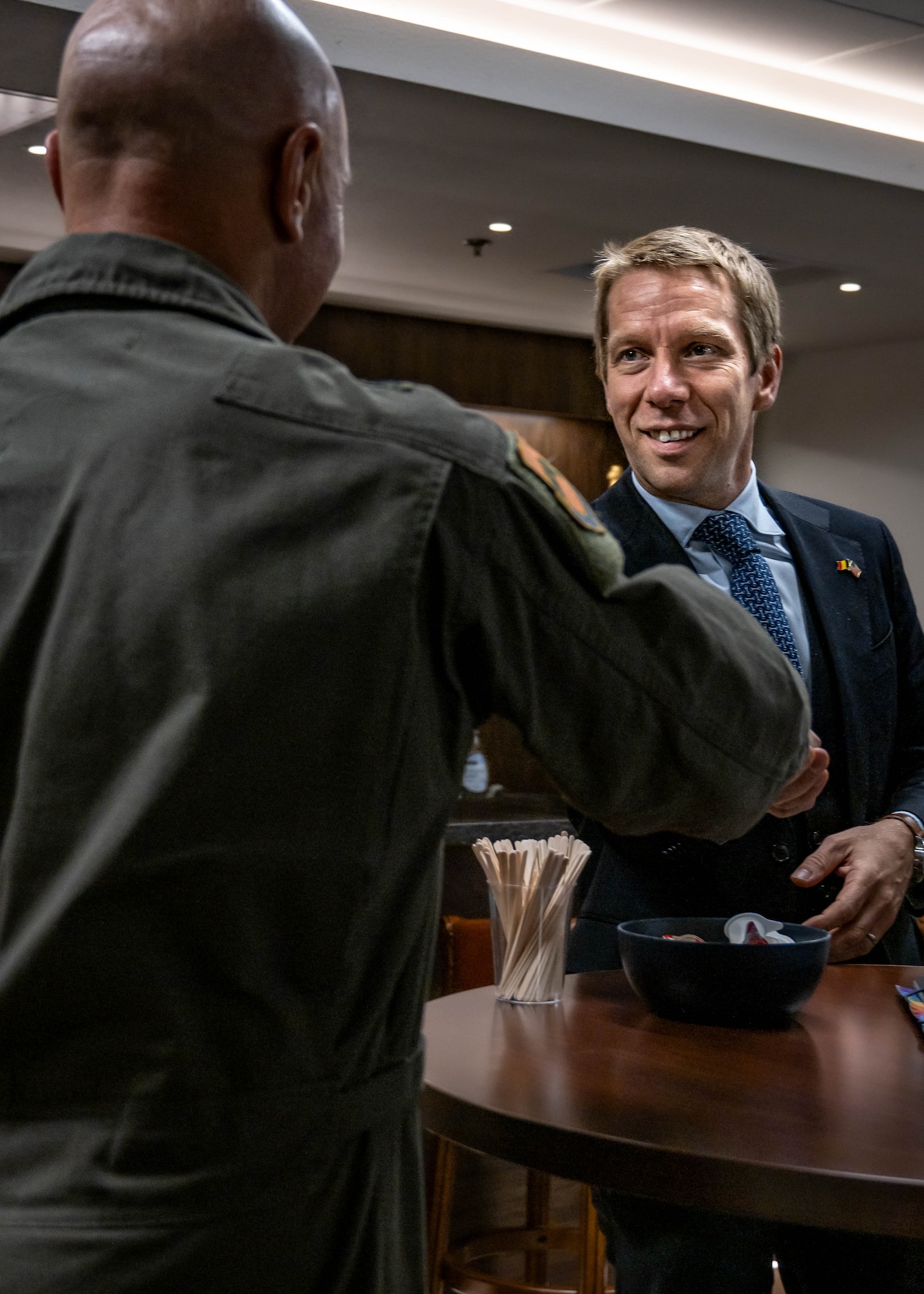 U.S. Air Force Brig. Gen. David Berkland (left), 56th Fighter Wing commander, greets Frederic Bernard (right), Belgian Ambassador to the United States